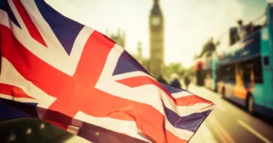 UK Union Jack flag flying near Big Ben in Westminster, London, symbolising national social care reform